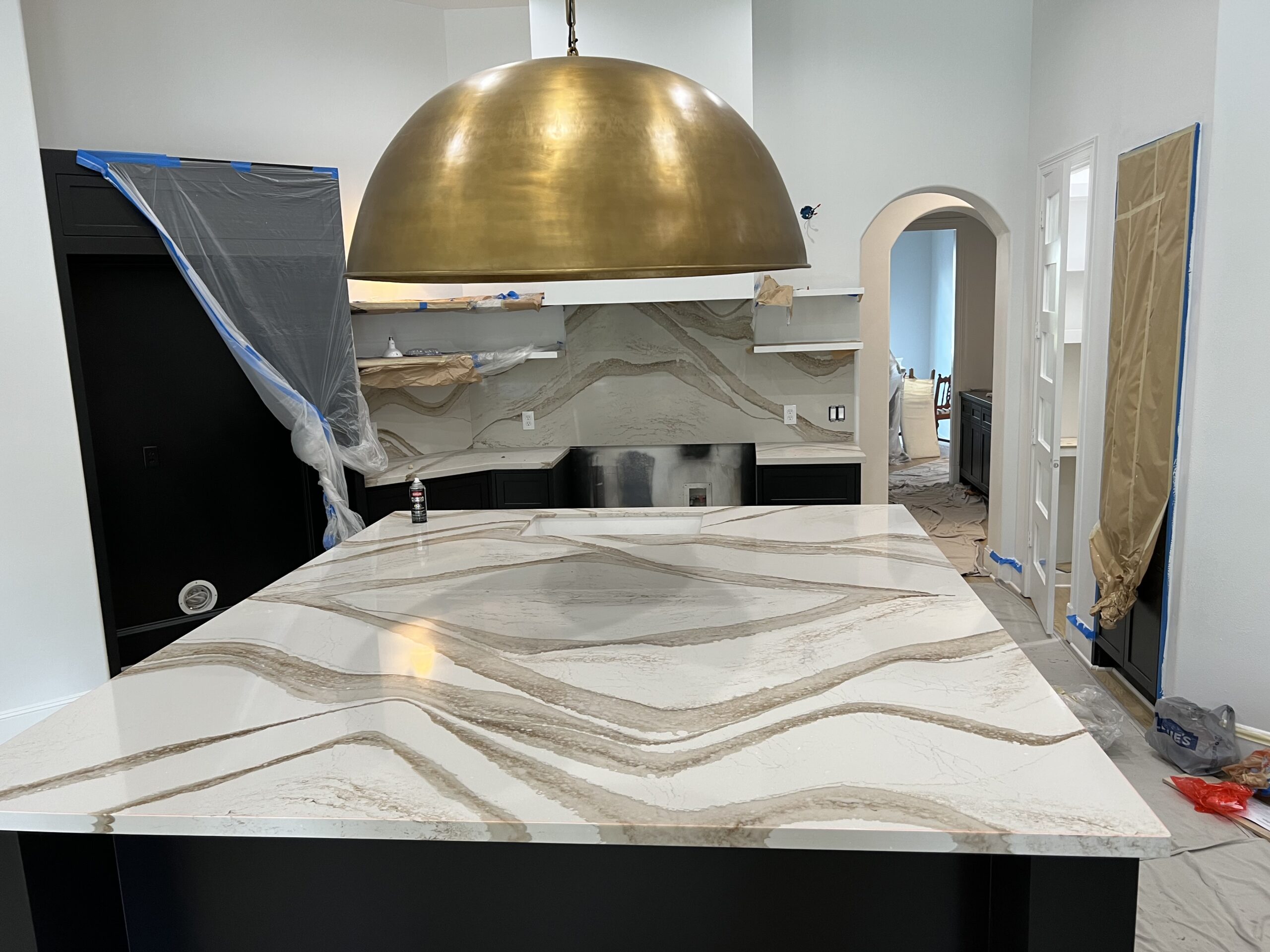 A kitchen counter with white and gold lining